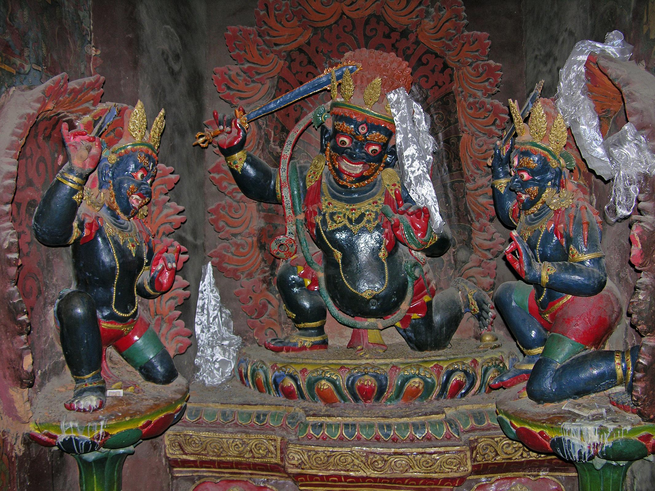 Tibet 06 10 Gyantse Kumbum Chandamaharoshana In the Gyantse Kumbum, standing on a lotus platform against a fiery halo of flames, there are three statues of the Buddhist guardian deity Chandamaharoshana (Tib. Achala). His name may be translated as 